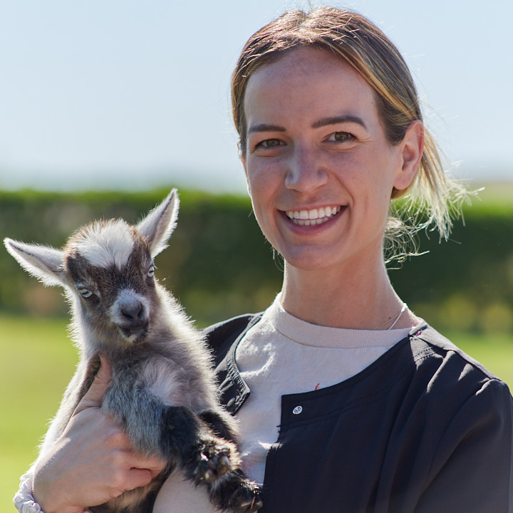 BrightStart nurse with baby goat.